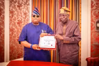 Governor Adeleke presents certificate of return to President Tinubu