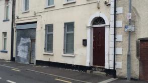 A man has been detained in connection with an assault on a mosque in Northern Ireland