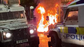 Protesters in Belfast hurl petrol bombs at police as rioting in the UK escalates